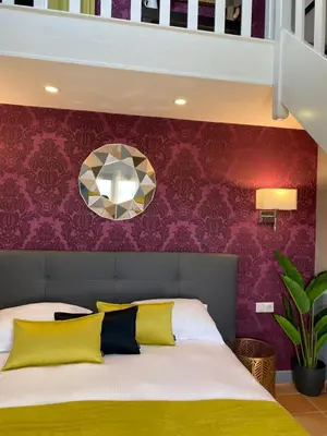 Un ou plusieurs lits dans un hébergement de l'établissement Hotel Les Suites - Domaine de Crécy