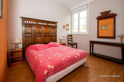 Un ou plusieurs lits dans un hébergement de l'établissement Maison familiale à Lametz avec jardin et équipements de loisirs