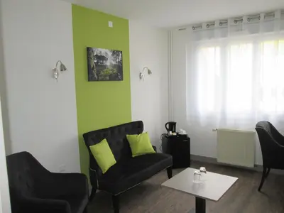 Coin salon dans l'établissement Auberge en Ardenne