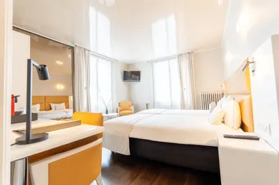 Un ou plusieurs lits dans un hébergement de l'établissement Hotel d'Angleterre