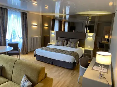 Un ou plusieurs lits dans un hébergement de l'établissement Hotel d'Angleterre