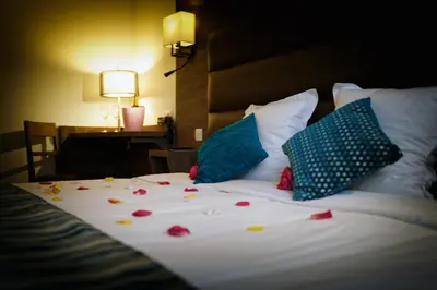 Un ou plusieurs lits dans un hébergement de l'établissement Logis Auberge Des Moissons