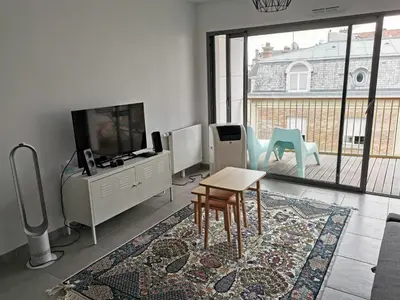Télévision ou salle de divertissement dans l'établissement Appartement Forum Reims