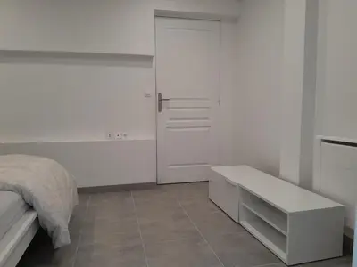 Un ou plusieurs lits dans un hébergement de l'établissement Maison Duplex & Appartement sur cour