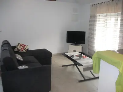 Télévision ou salle de divertissement dans l'établissement Le Moulin De Laval
