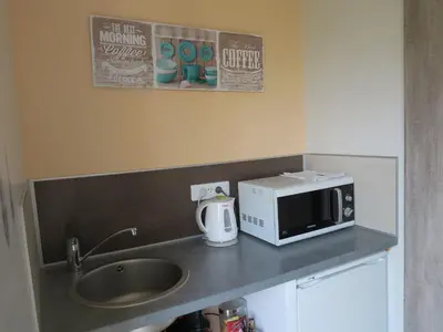 Cuisine ou kitchenette dans l'établissement Les Collinades de Chalons