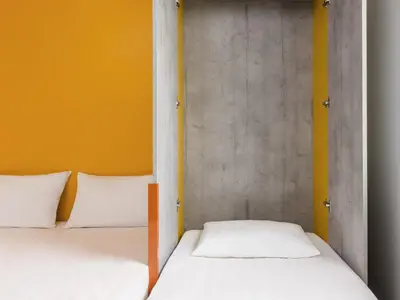 Un ou plusieurs lits dans un hébergement de l'établissement Ibis Budget Château-Thierry
