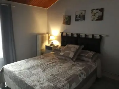 Un ou plusieurs lits dans un hébergement de l'établissement La petite auberge