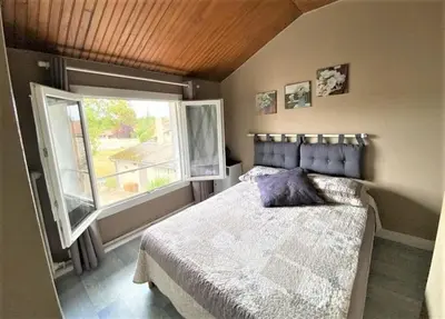 Un ou plusieurs lits dans un hébergement de l'établissement La petite auberge