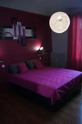 Un ou plusieurs lits dans un hébergement de l'établissement L'Iliade - Chambres d'hôtes - B&B à Bouzy