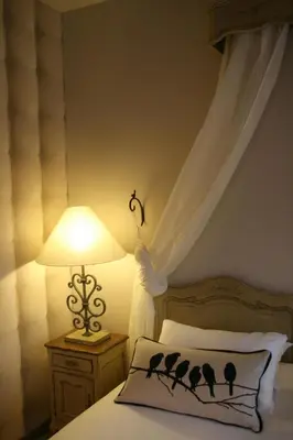 Un ou plusieurs lits dans un hébergement de l'établissement Le Prieuré Chambres d'hôtes