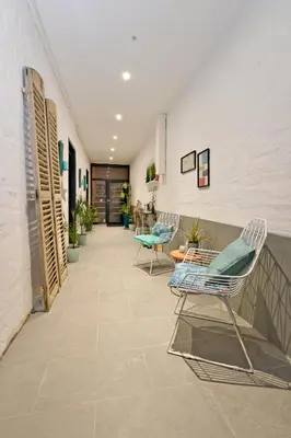 Coin salon dans l'établissement Chambres d'hotes Les Nuits Pastel
