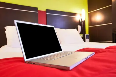 Un ou plusieurs lits dans un hébergement de l'établissement Enzo Hotels Reims Tinqueux