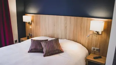Un ou plusieurs lits dans un hébergement de l'établissement Hôtel du Tramway