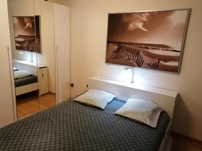 Un ou plusieurs lits dans un hébergement de l'établissement Joli Appartement Coquet