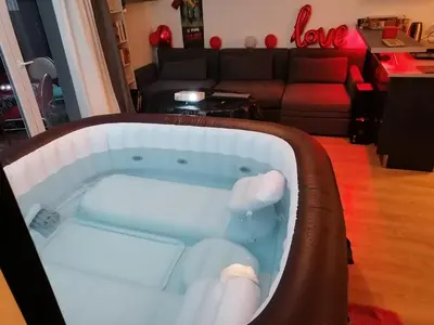 Coin salon dans l'établissement Joli Appartement Coquet