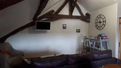 Télévision ou salle de divertissement dans l'établissement Chambre du Nouvion