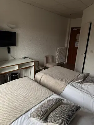 Un ou plusieurs lits dans un hébergement de l'établissement Hotel du Pot d'Etain