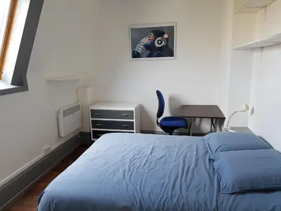 Un ou plusieurs lits dans un hébergement de l'établissement Le logis de Tania - 2 chambres - Rue calme dans centre ville
