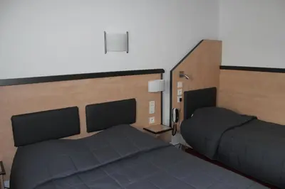 Un ou plusieurs lits dans un hébergement de l'établissement Hôtel de la Meuse