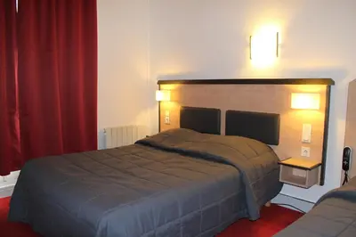 Un ou plusieurs lits dans un hébergement de l'établissement Hôtel de la Meuse