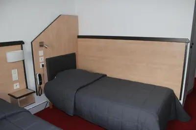 Un ou plusieurs lits dans un hébergement de l'établissement Hôtel de la Meuse