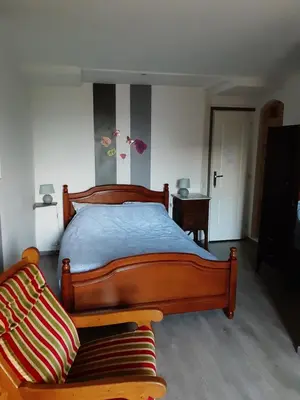 Un ou plusieurs lits dans un hébergement de l'établissement Chambre D'Hôtes avec petit Déjeuner