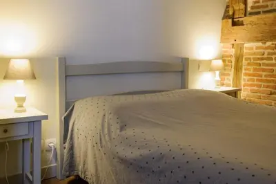 Un ou plusieurs lits dans un hébergement de l'établissement Hôtel Les Chevaliers