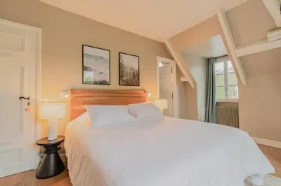 Un ou plusieurs lits dans un hébergement de l'établissement Le Moulin de l'Ortille & SPA