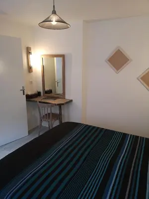 Un ou plusieurs lits dans un hébergement de l'établissement Cottage AU TERMINUS