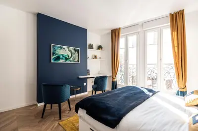 Un ou plusieurs lits dans un hébergement de l'établissement MM Suites Marlot