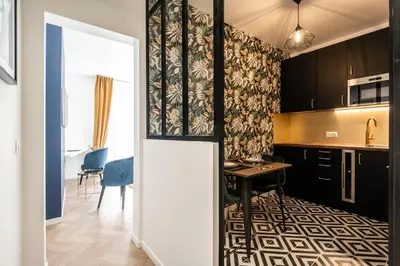 Cuisine ou kitchenette dans l'établissement MM Suites Marlot
