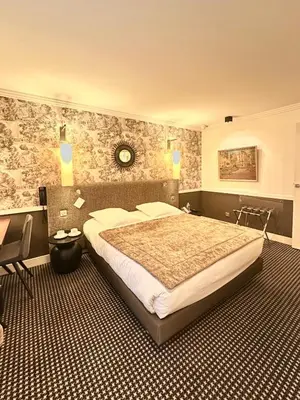 Un ou plusieurs lits dans un hébergement de l'établissement Hotel Maison Lia