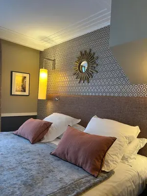 Un ou plusieurs lits dans un hébergement de l'établissement Hotel Maison Lia