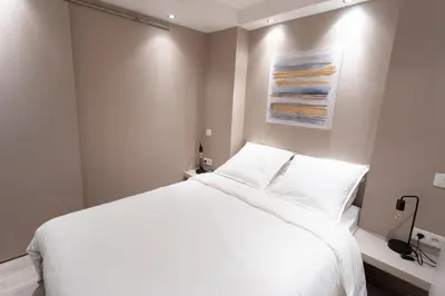 Un ou plusieurs lits dans un hébergement de l'établissement Appartement au pied de la cathédrale