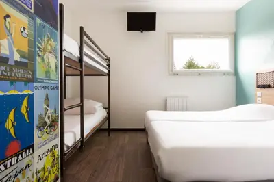 Un ou plusieurs lits dans un hébergement de l'établissement Hôtel F1 Reims Tinqueux