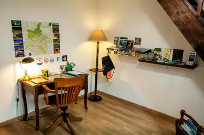 Télévision ou salle de divertissement dans l'établissement Gîte 