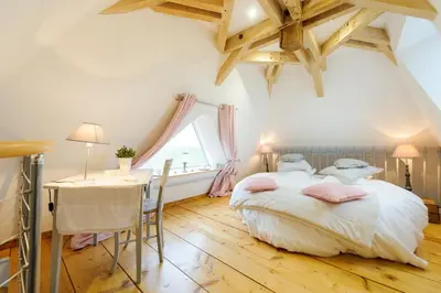 Un ou plusieurs lits dans un hébergement de l'établissement Les Chambres de Ribeaufontaine