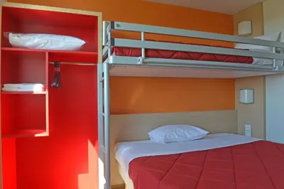 Un ou plusieurs lits dans un hébergement de l'établissement Premiere Classe Reims Nord - Bétheny