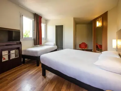 Un ou plusieurs lits dans un hébergement de l'établissement Ibis Château-Thierry