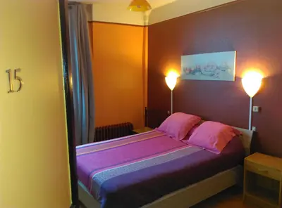 Un ou plusieurs lits dans un hébergement de l'établissement Hotel le Rallye