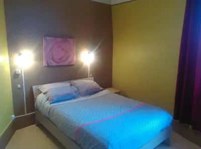Un ou plusieurs lits dans un hébergement de l'établissement Hotel le Rallye