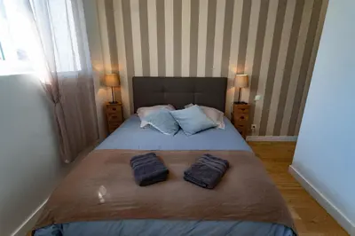 Un ou plusieurs lits dans un hébergement de l'établissement Gîte Le Pressoir