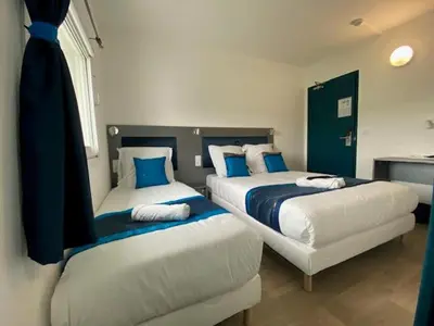 Un ou plusieurs lits dans un hébergement de l'établissement Fasthotel Soissons Nord