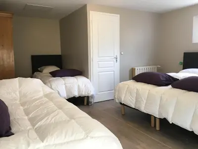 Un ou plusieurs lits dans un hébergement de l'établissement Gîte de la Miellerie