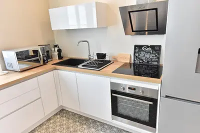 Cuisine ou kitchenette dans l'établissement Le 57 by Sparnapart