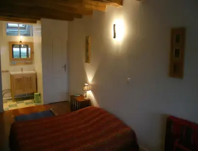 Un ou plusieurs lits dans un hébergement de l'établissement La Grange aux Loirs B&B