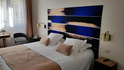 Un ou plusieurs lits dans un hébergement de l'établissement Hotel de Champagne