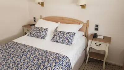 Un ou plusieurs lits dans un hébergement de l'établissement Hotel de Champagne