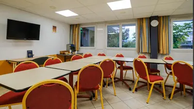 Télévision ou salle de divertissement dans l'établissement Hotel Tambourin
